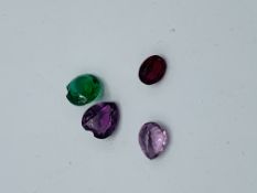 4 x coloured glass ""stones"". Estimate £10-20.