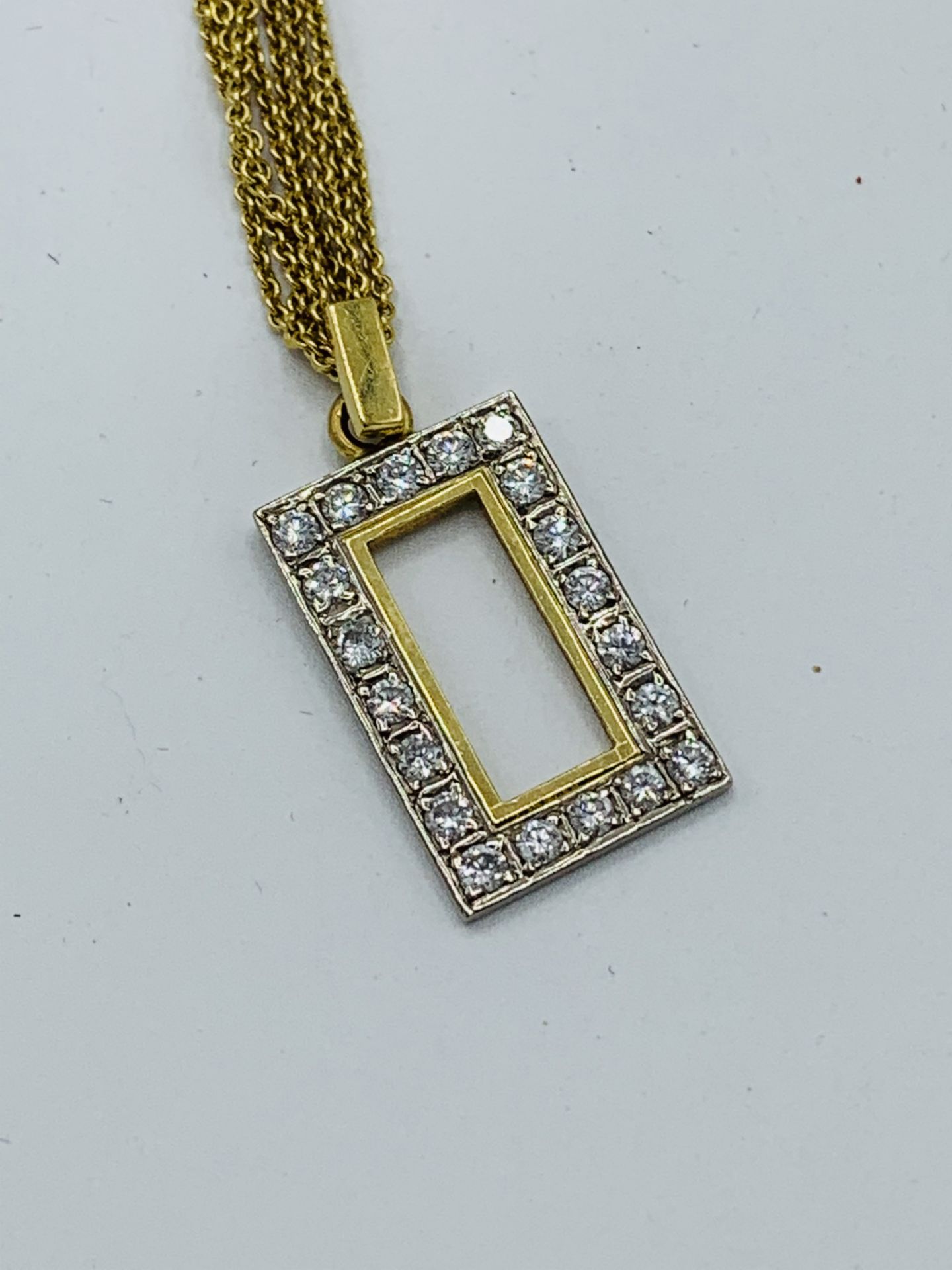 18ct gold and diamond square pendant on a 4 strand 18ct gold chain, chain length 42cms. Estimate £ - Image 2 of 3