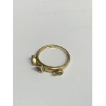 9ct gold ring with three gemstones, size P, weight 2.4gm. Estimate £20-30.