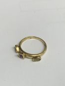 9ct gold ring with three gemstones, size P, weight 2.4gm. Estimate £20-30.