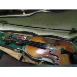 3 violins in cases as found. Estimate £20-40.