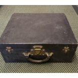 Louis Vuitton fitted dressing case, black textured leather exterior with brass lock and catches.