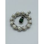 White metal pearl, diamond and tormaline pendant. Estimate £850-900.