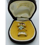 Yellow metal and garnet stone ring, size M, weight 4.3gms; 9ct white gold wedding band, size N,