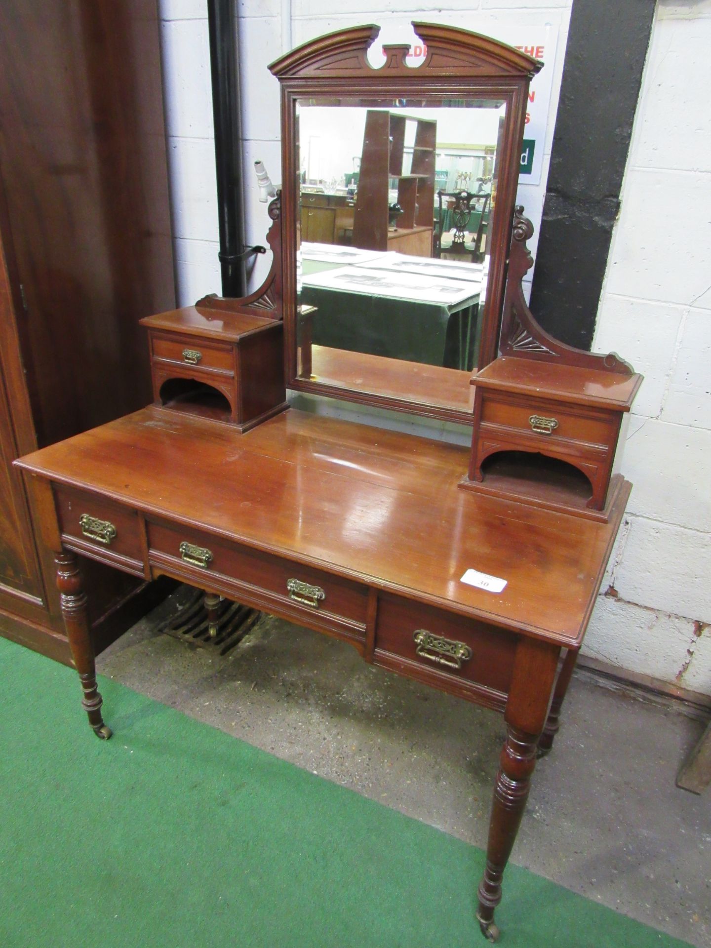 Mahogany dressing table with three frieze drawers, mirror flanked by two small cabinets, turned legs