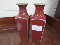2 Sang de Boeuf vases. Height 26cms. Estimate £40-60.