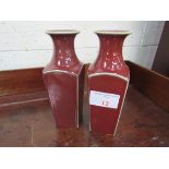 2 Sang de Boeuf vases. Height 26cms. Estimate £40-60.