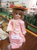 Armand Marseille 390 2/0 x 14inch girl doll with fixed eyes and vintage clothes. Estimate £55-100.