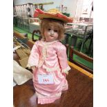 Armand Marseille 390 2/0 x 14inch girl doll with fixed eyes and vintage clothes. Estimate £55-100.