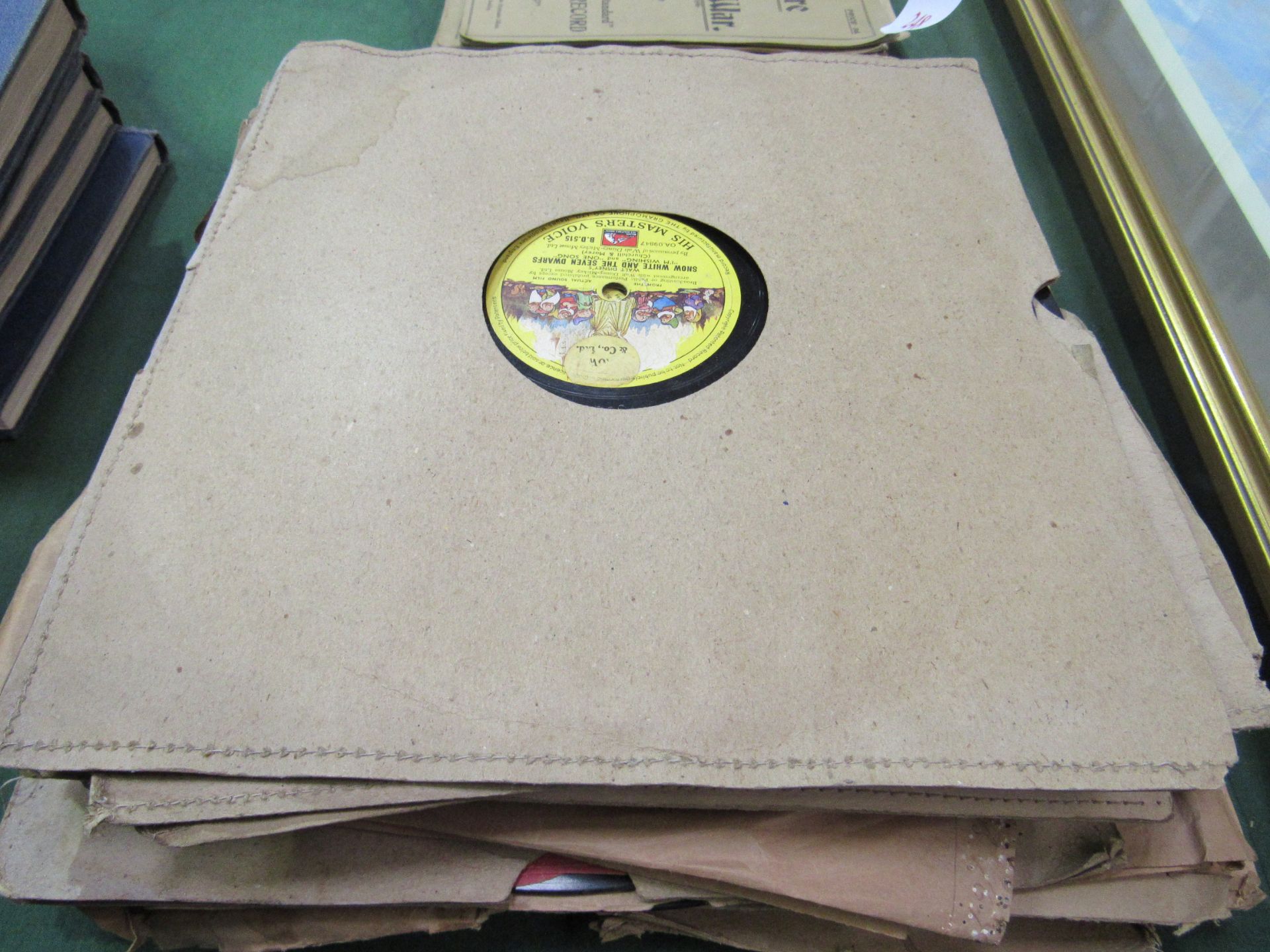 Quantity of early 78 RPM records including children's nursery rhymes. Estimate £10-20.