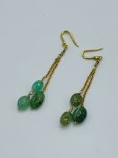 Natural green stone drop earrings. Estimate £150-200.