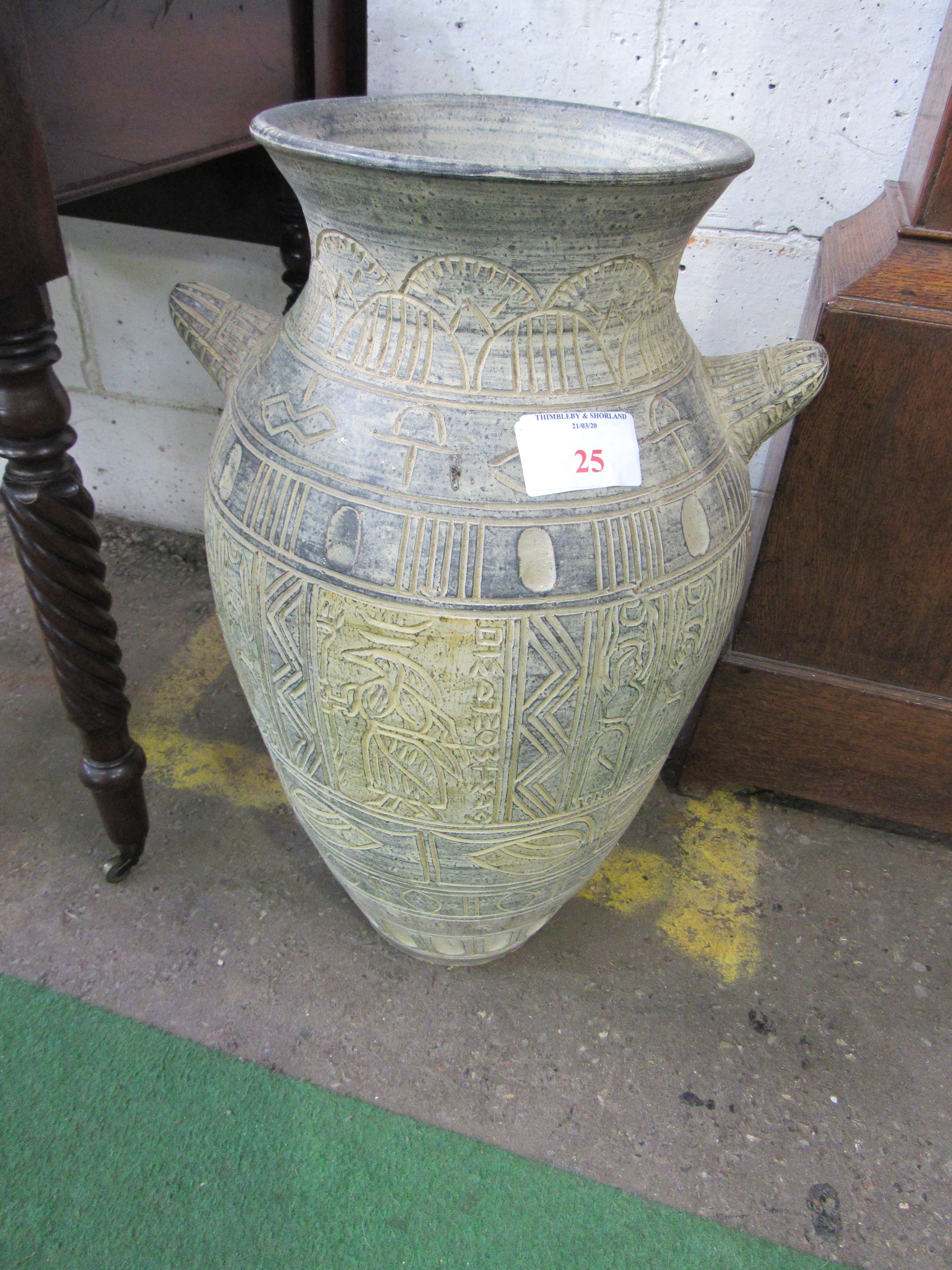 Large Egyptian-style vase. Height 64cms. Estimate £30-40.