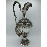Italian 800 silver highly decorated ewer, weight 31 ozt, height 42cms. Estimate £200-250.