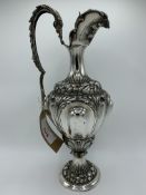 Italian 800 silver highly decorated ewer, weight 31 ozt, height 42cms. Estimate £200-250.