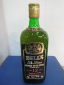26 2/3fl.oz bottle of Bells De Luxe blended Scotch whisky 12 year old, 70 proof. Estimate £20-40.