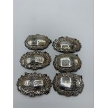 6 silver decanter labels, total weight 2.4ozt. Estimate £20-30.