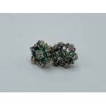 Two emerald and diamond earrings, one as found. Estimate £50-80.