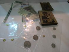 Collection of notes, coins and medals, together with 2 Russian icons. Estimate £10-20.