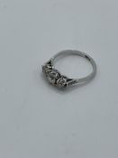 18ct white gold 3 stone old cut diamond ring, weight 2.7gms, size Q 1/2. Estimate £700-750.