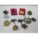 Quantity of military badges together with 2 German medals. Estimate £25-35.