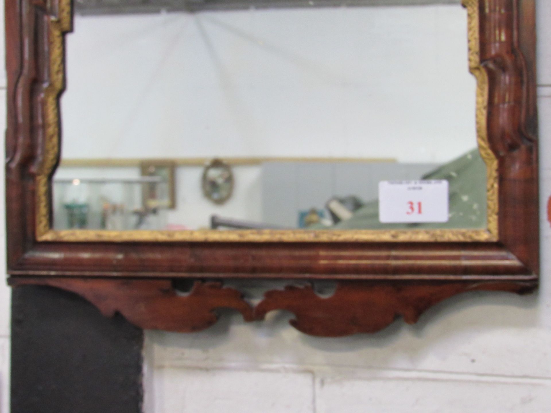 A Georgian mahogany Sheraton wall mirror. Mahogany veneer with parcel gilt waterfall relief - Image 3 of 3