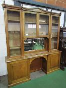 Oak glass top display cabinet with mirror and 2 cupboards to base. 210 x 42 x 236cms. Estimate £50-