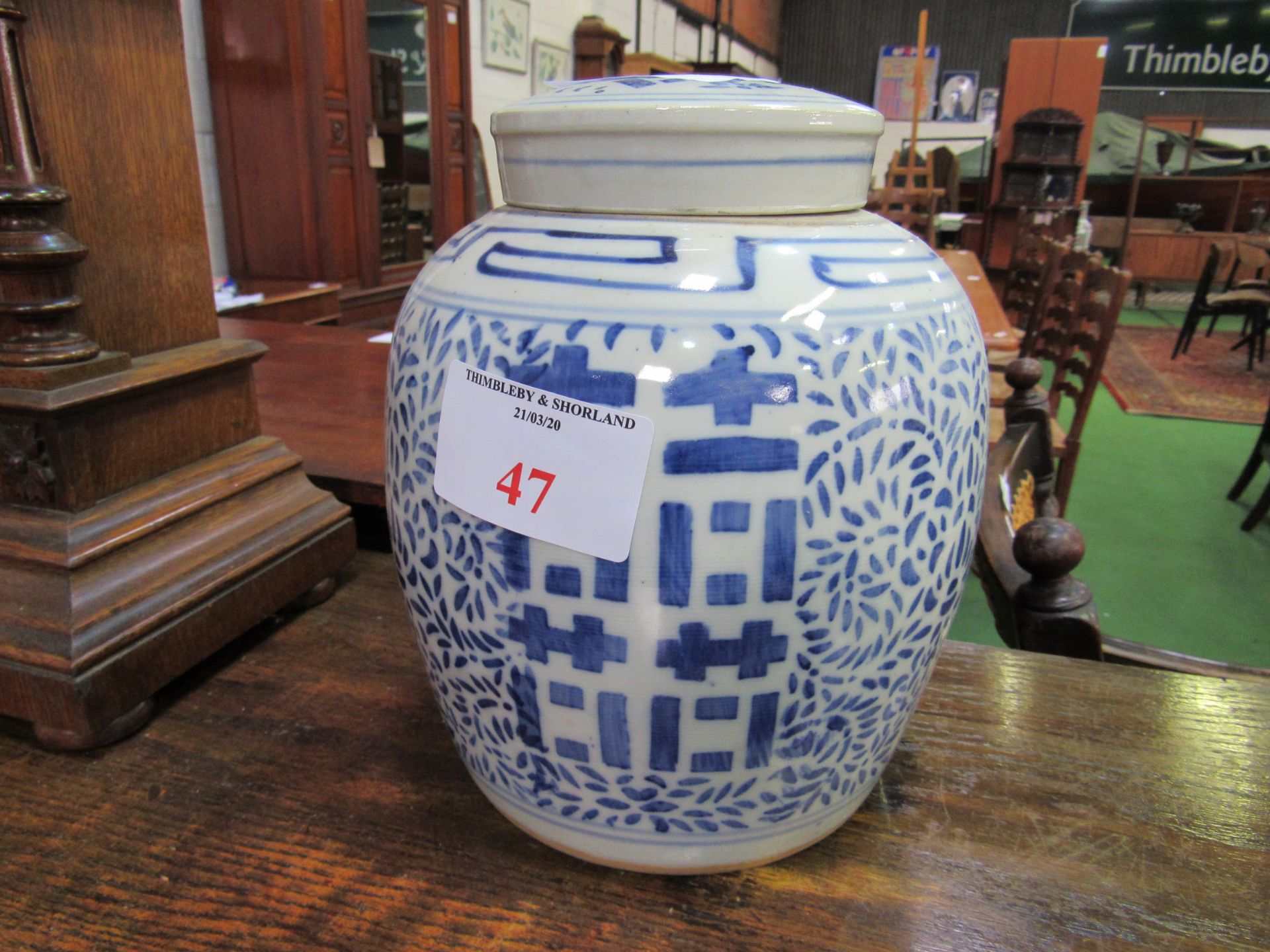 Pair of blue and white oriental covered jars. Estimate £30-50.