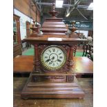 Oak case mantel clock with finial decoration. Height 52cms. Estimate £40-60.