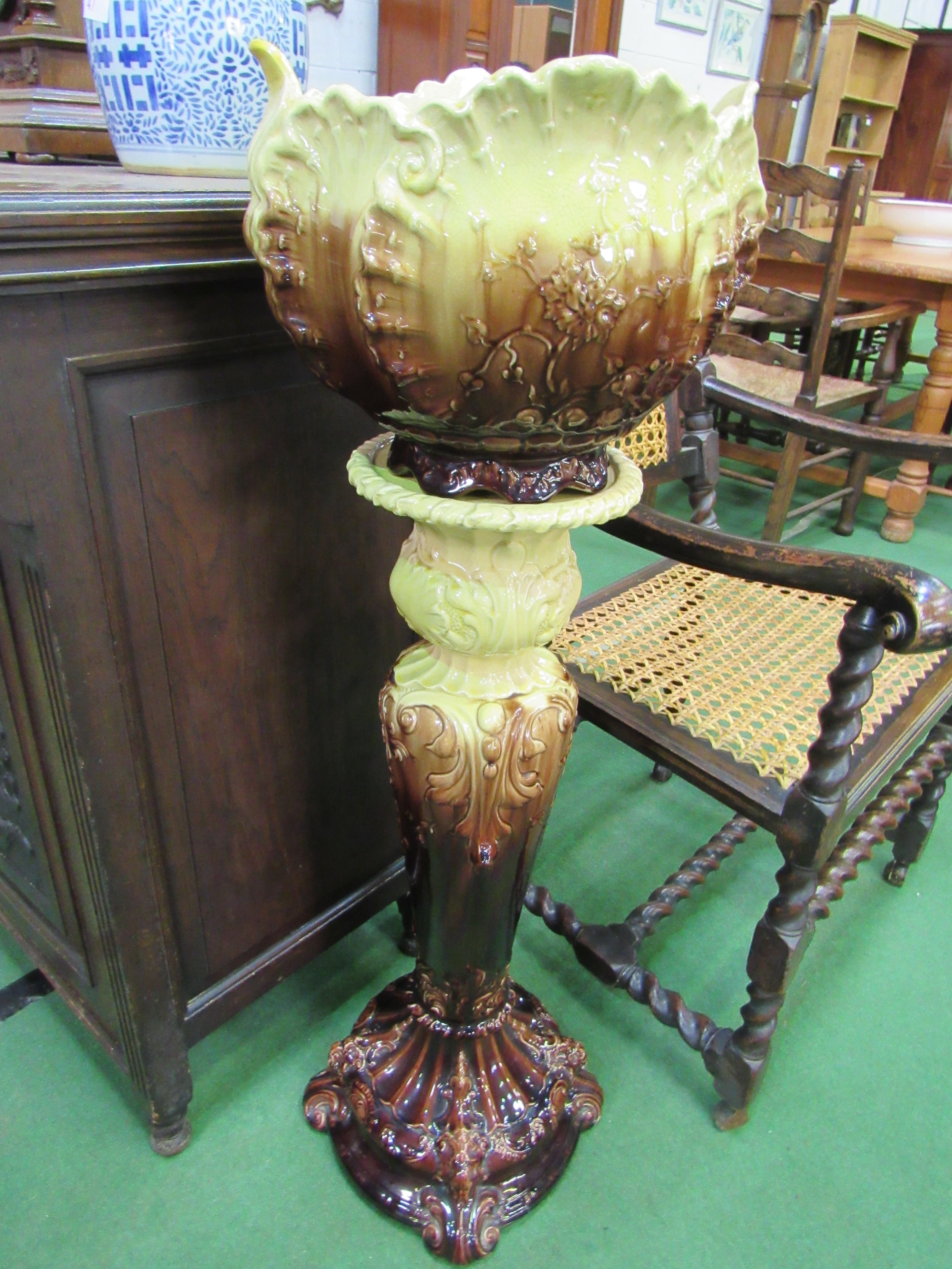 19th Century Staffordshire Majolica cabbage leaf jardinière on matching stand. Estimate £50-80.