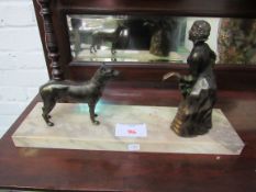 Large Art Deco bronze lady with her dog, mounted on variegated marble base. Estimate £60-90.