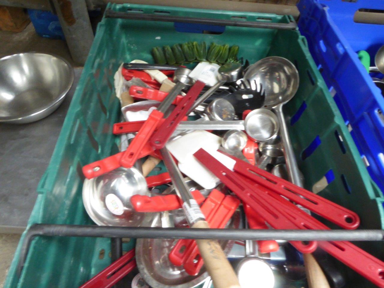 Tray of ladles and spatulas.