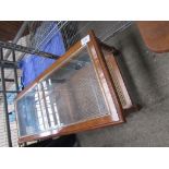 Mahogany glass top coffee table with cane shelf beneath.