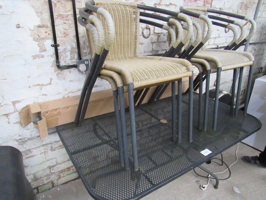 Metal garden table, 6 chairs and an umbrella.
