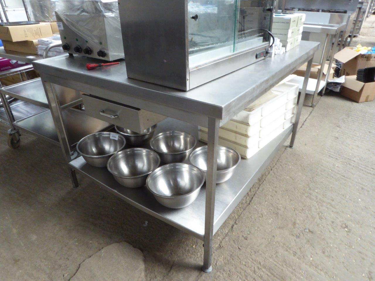 Stainless-steel centre table with 2 drawers.