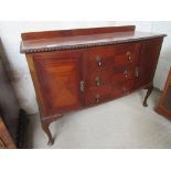 Mahogany curved front sideboard with 3 centre drawers, flanked by cupboards, 135 x 52 x 92cms.