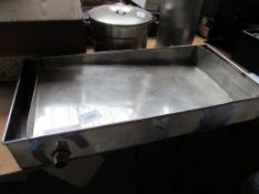 Stainless steel honey uncapping tray.