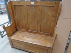 Old pine high back bench with lifting lid. 123 x 43 x 136cms.