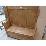 Old pine high back bench with lifting lid. 123 x 43 x 136cms.