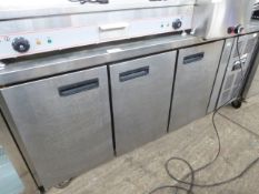 Stainless steel 3 door counter fridge.