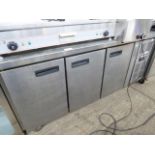 Stainless steel 3 door counter fridge.