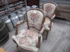 2 upholstered French style open armchairs.