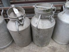 2 aluminium churns with lids.