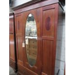 Edwardian mahogany wardrobe with oval door mirror & drawer to base, 116 x 45 x 204cms.