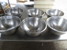 6 large stainless steel bowls.