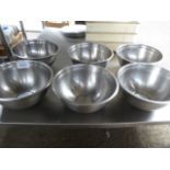 6 large stainless steel bowls.