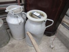 2 aluminium churns with lids.