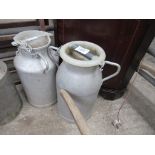 2 aluminium churns with lids.