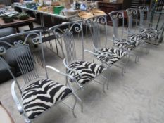 6 decorative metal framed faux zebra upholstered armchairs.