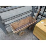 Child's wooden pull-along cart.