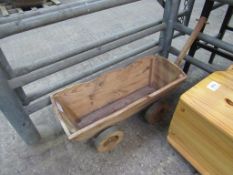 Child's wooden pull-along cart.